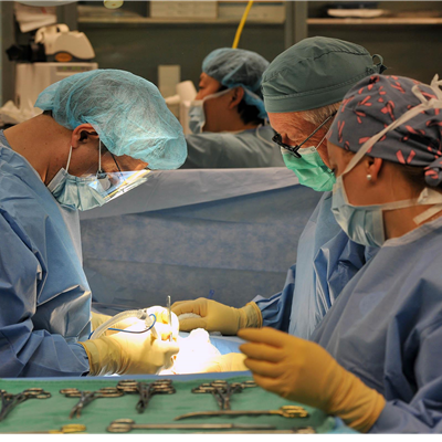 Nicole Daniels in operating room working with Dr. 