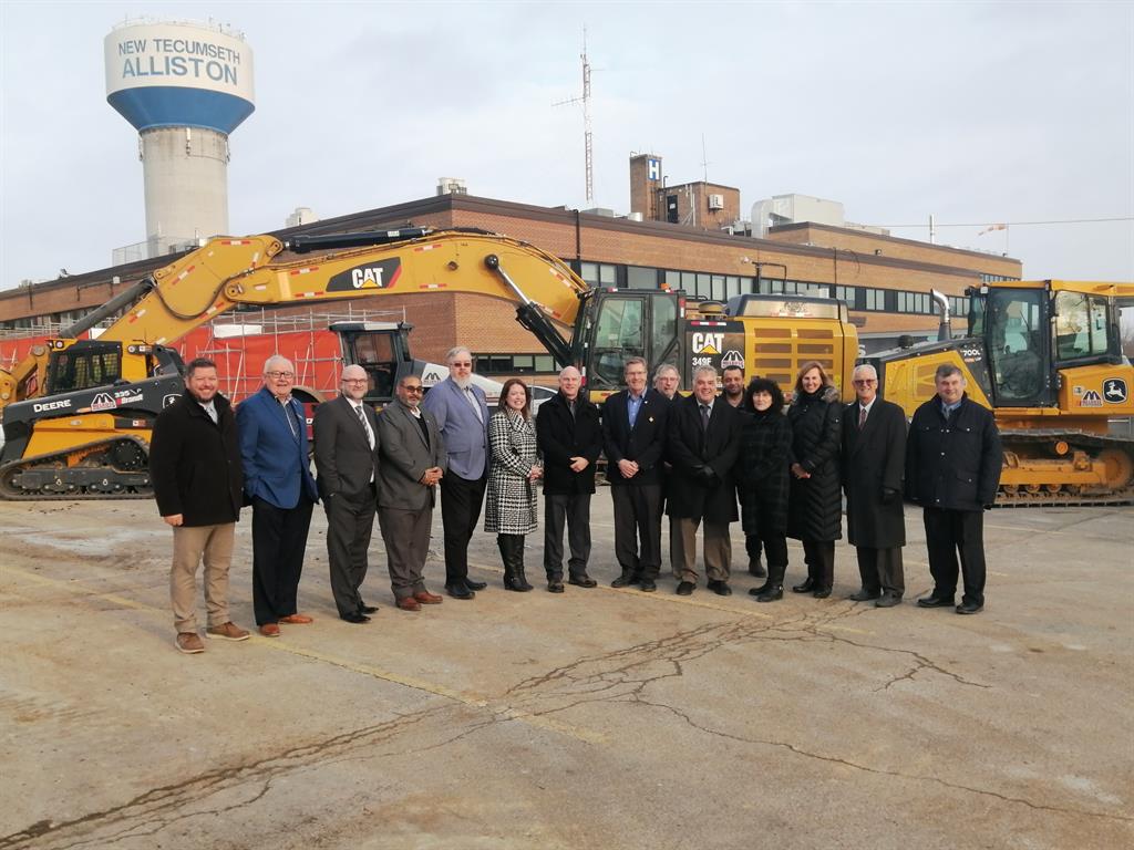 local politicians and SMH staff outside of SMH building near construction