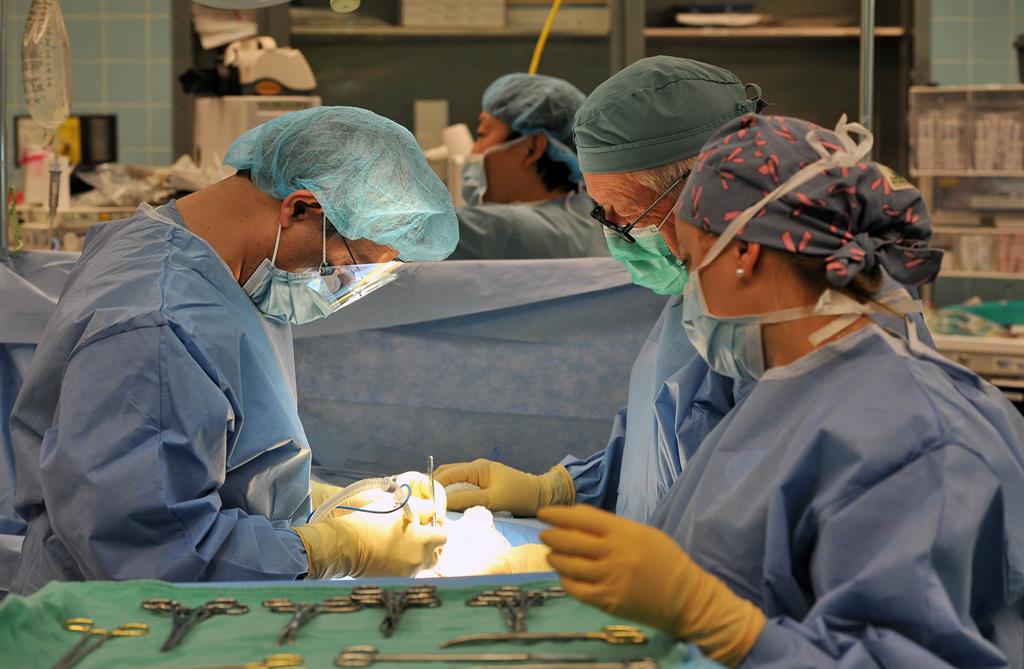 Nicole daniels working in operating room alongside Dr. Keshoofy